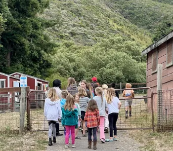 children heading up to the upper barns